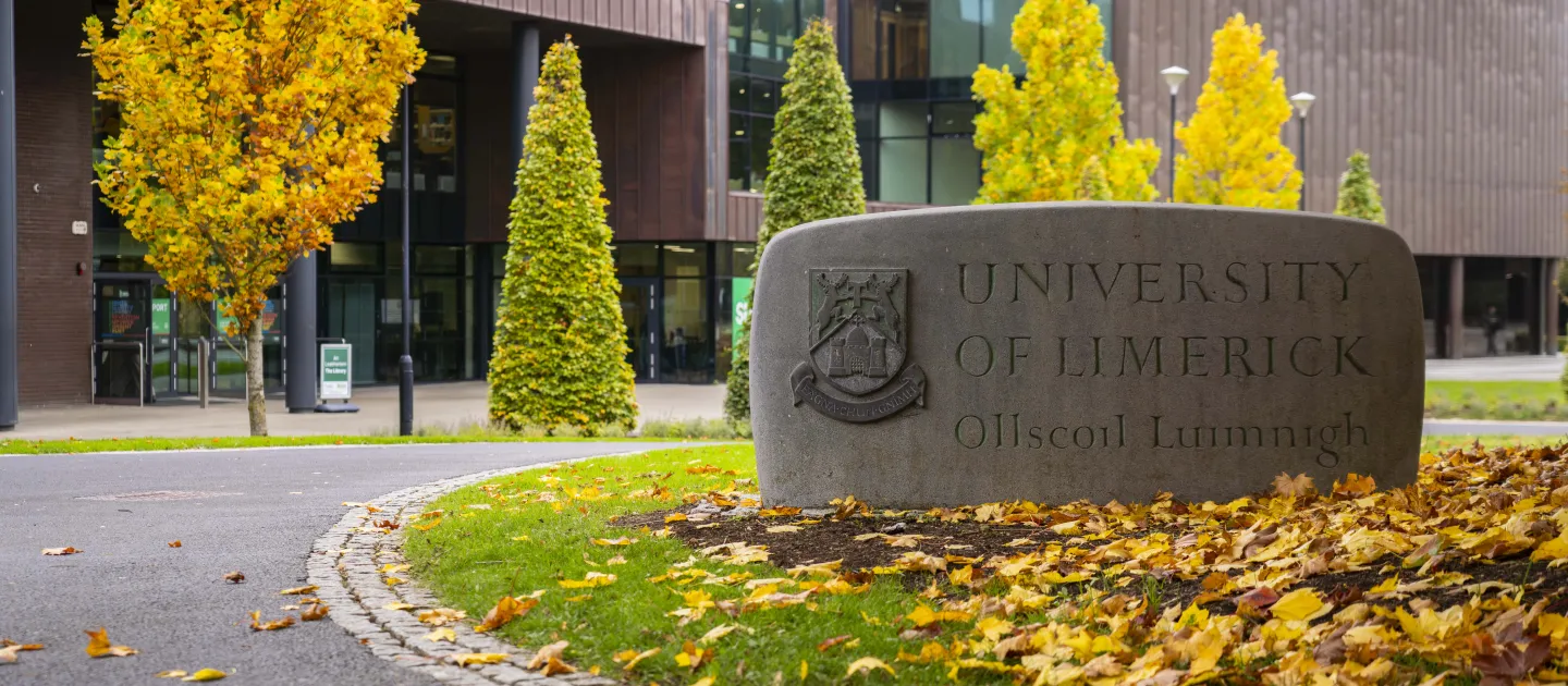Autumn campus stone with University of Limerick written on it 