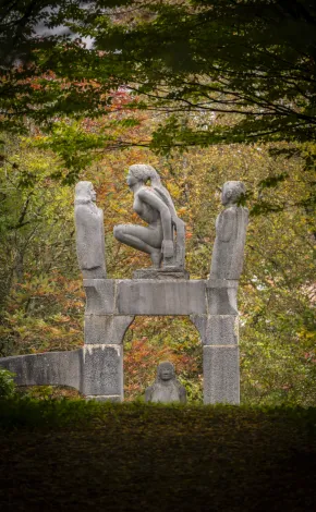 statues on UL campus with autumnal trees 