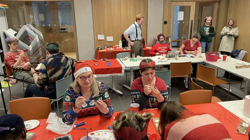Dot Madden pictured with mature students painting Xmas decorations
