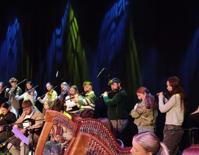 Group of Irish traditional musicians performing on stage