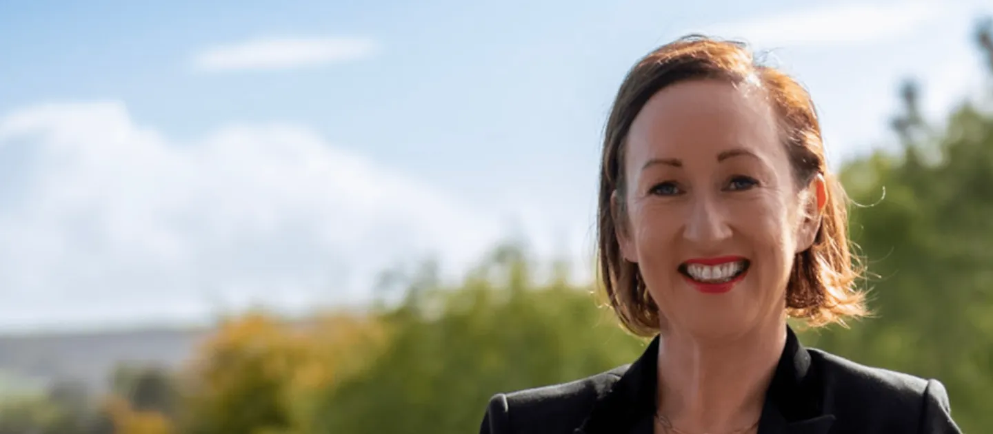 Lady with dark hair smiling